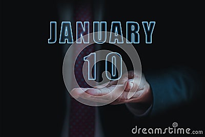 january 10th. Day 10 of month, announcement of date of business meeting or event. businessman holds the name of the month and day Stock Photo