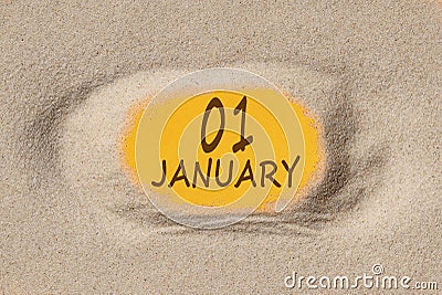 January 1. 1th day of the month, calendar date. Hole in sand. Yellow background is visible through hole Stock Photo