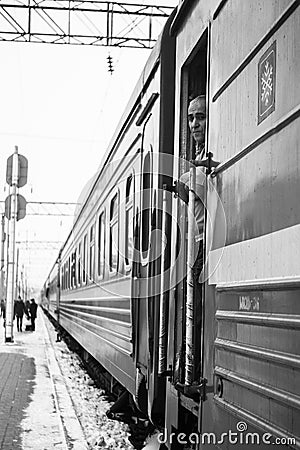 January 15, 2019. train conductor is on his duty on a platform and other trains Editorial Stock Photo