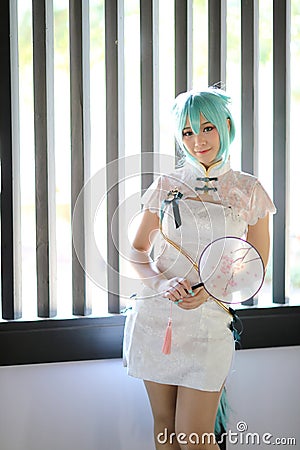 Japan anime cosplay portrait of a girl with chinese dress costume in chinese garden Stock Photo