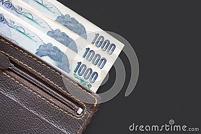 Japan currency paper banknote and coins on dark background, bank Stock Photo