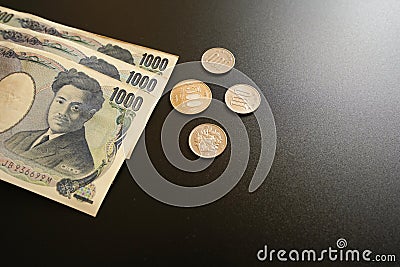 Japan currency paper banknote and coins on dark background, banking economic and finance concept, Japanese money investment , Stock Photo