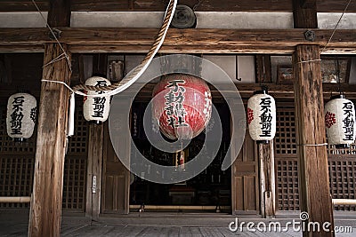 8.2018 Japan Kyoto.Buddhist temple.Visitors pray on area of Kinkaku-ji shrine Editorial Stock Photo