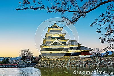 Japan. Matsumoto Castle at sunset. Cherry blossom. Sakura Editorial Stock Photo