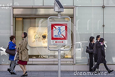 Japan, Tokyo, 04/12/2017. People on the street, walking in different directions Editorial Stock Photo