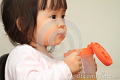 Japanese baby girl drinking water Stock Photo