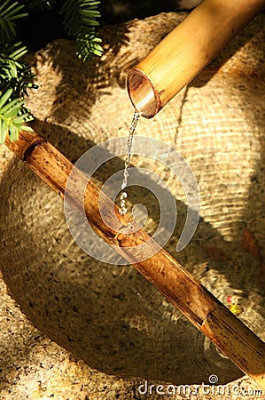 A Japanese bamboo garden water fountain Stock Photo