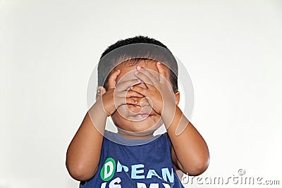 Japanese boy playing peek-a-boo Stock Photo