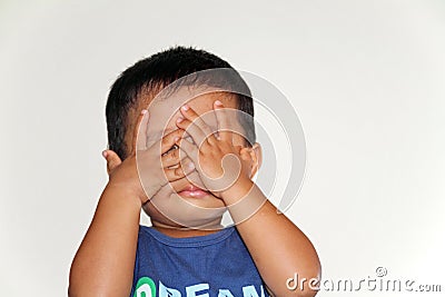 Japanese boy playing peek-a-boo Stock Photo