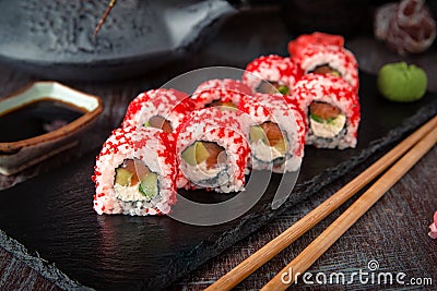 Japanese California Roll with salmon, avocado, cucumber, cream with Philadelphia cheese, tobiko caviar Sushi menu. Stock Photo