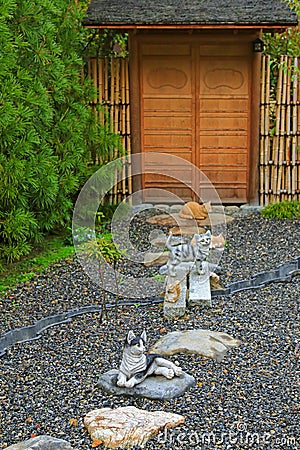 Japanese ceramic cats as lucky charm to decorate the zen styled Stock Photo