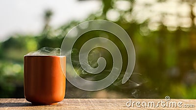 Japanese ceramic tea cup on wooden desk in the morning. Stock Photo