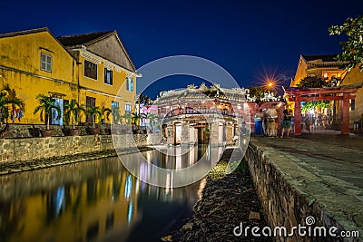 Japanese Covered ancient Bridge and River in Street in Old city of Hoi An in Southeast Asia in Vietnam. Vietnamese heritage and Stock Photo