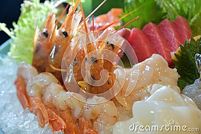 Raw shrimp sashimi Amaebi tuna fish shell platter icecube Stock Photo