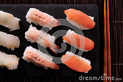Japanese food sushi black slate chopsticks top view Stock Photo