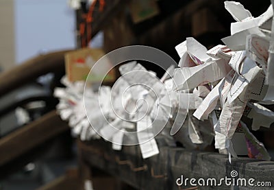 Japanese fortunes written on strips of paper Stock Photo
