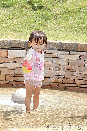 Japanese girl playing with water Stock Photo