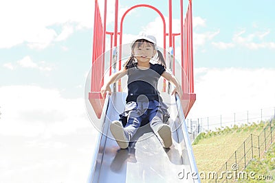 Japanese girl on the slide Stock Photo