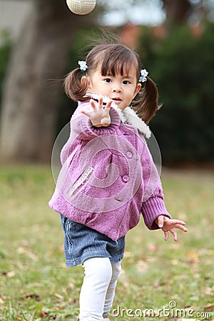 Japanese girl playing catch Stock Photo