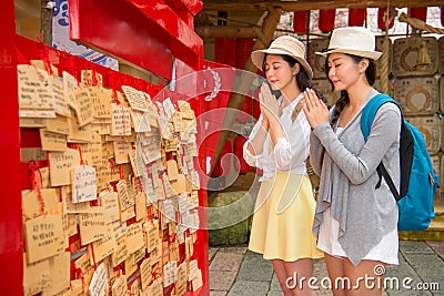 Japanese girls prayers on wooden plaques ema Stock Photo