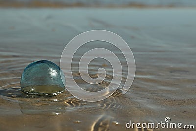 Handblown Glass Float Washed in the Surf Stock Photo
