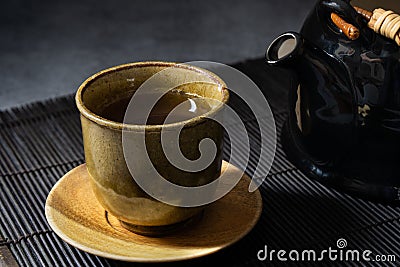 Japanese green tea in a traditional and beautiful clay cup. Stock Photo