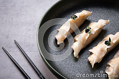 Japanese gyoza dumplings on grey stone table background. Traditional asian food Stock Photo