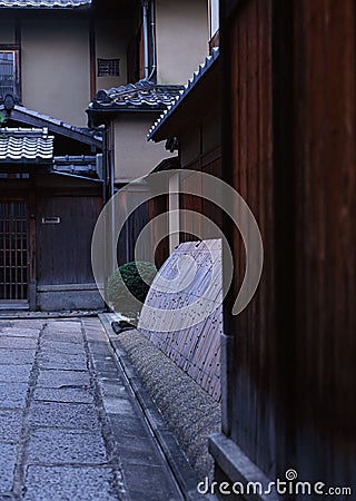 Japanese house architecture elements consisting of walls and stone pathways Stock Photo