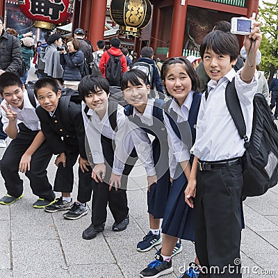 Japanese kids taking group selfie Editorial Stock Photo