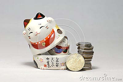 Japanese Lucky Cats and yen Stock Photo