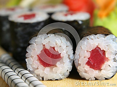 Japanese maki roll with tuna on a wooden tray close-up Stock Photo