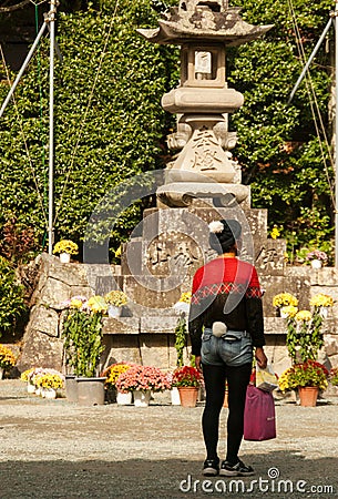 Japanese man with quirky dress sense visiting a temple Editorial Stock Photo