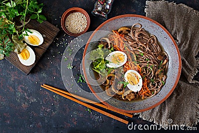 Japanese miso ramen noodles with eggs, carrot and mushrooms. Soup delicious food. Stock Photo