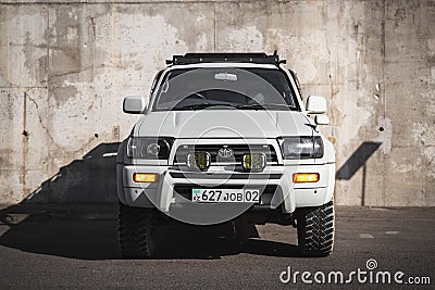 Japanese offroad used white car Toyota Hilux Surf, front view Editorial Stock Photo