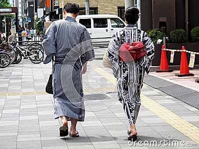 Japanese people couple lovers wearing traditional japan clothes yukata walking go to travel visit and respect praying god deity Editorial Stock Photo