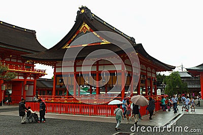 Japanese people and tourists enter Fushimi Inari Shrine Editorial Stock Photo