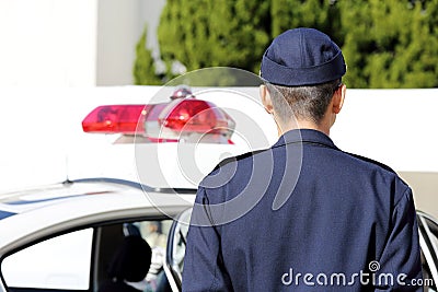 Japanese police officer with patrol car Editorial Stock Photo