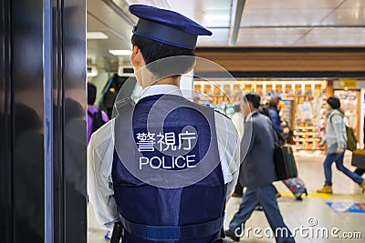 Japanese Policeman in Tokyo station Editorial Stock Photo