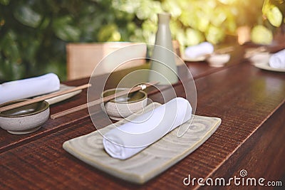 Japanese restaurant in traditional style, Empty plate on mat near chopstick bowl, Selective Focus Stock Photo