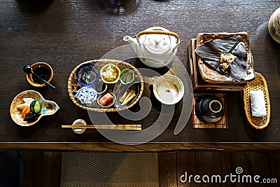 Japanese ryokan breakfast appetizer dishes including mentaiko, pickle, seaweed, bamboo shoot, hot plate, other side dishes Stock Photo