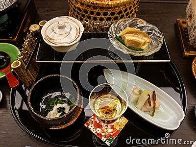 Japanese ryokan kaiseki dinner appetizer including cherry blossom tofu, lily bulb tofu, horse tail, silvervine and sesame Stock Photo