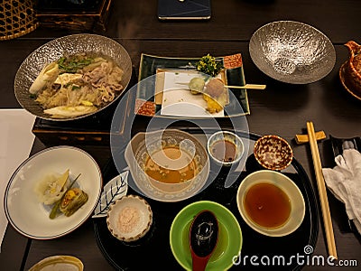 Japanese ryokan kaiseki dinner main dish including pork shabu hot pot, variety of vegetables, with salt and sesame vinegar sauce Stock Photo