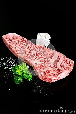 Beef isolated on the black with salt pepper and beef tallow Stock Photo