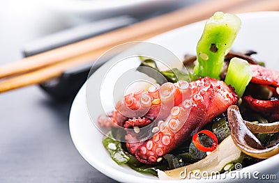 Japanese salad with octopus and ginger. Healthy food. Seafood closeup over black Stock Photo