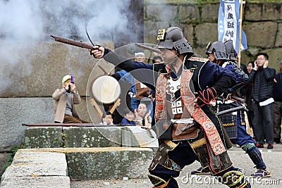 Japanese samurai with old rifle Editorial Stock Photo