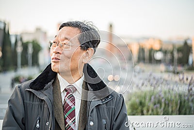 Japanese senior old man outdoors smiling and happy portrait Stock Photo