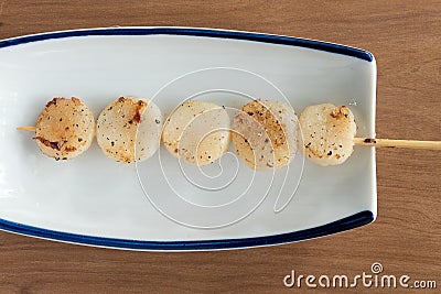 Japanese skewered salt seasoned scallops Stock Photo