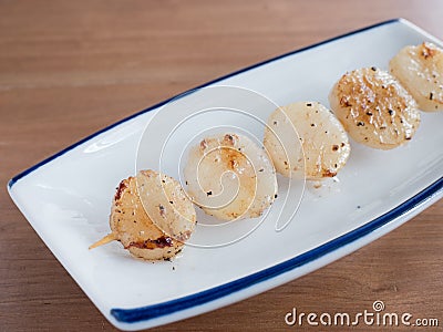 Japanese skewered salt seasoned scallops Stock Photo
