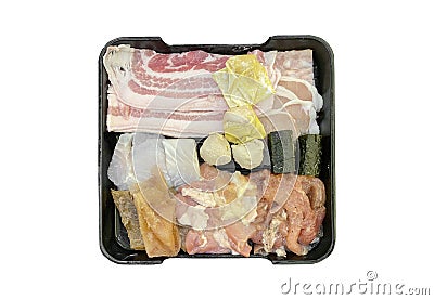 Japanese sliced pork, wontan, fish on dish isolated on white background for shabu shabu sukiyaki. Stock Photo