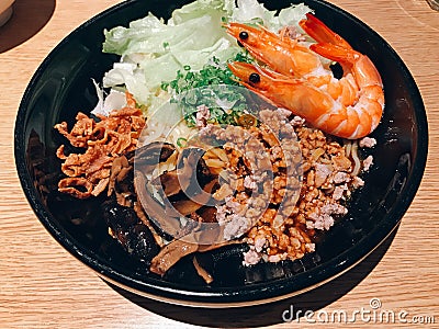 Japanese style noodle topped with minced pork sauce and prawn. Stock Photo